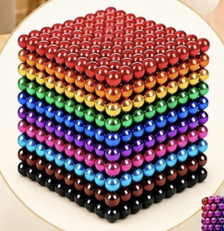 Rainbow colored beeds stacked in a cube shape